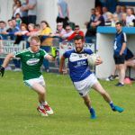Gweedore's Shane Ferry chasing down Cloughaneely's Ciaran McGeady at Pirc Naomh Fhionin yesterday.