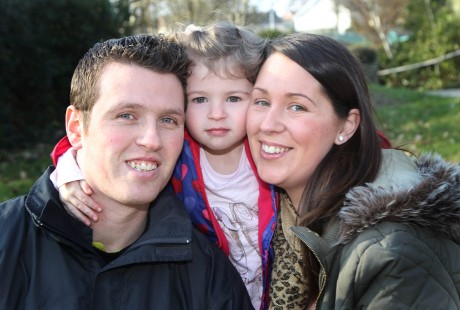 John and Allison McFadden with their daughter Taylor Beth who has received one Cochlear implant to-date. Photo: Donna McBride