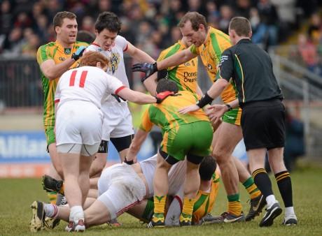 Stephen O'Neill, Tyrone, and Neil McGee, Donegal, during an altercation as players from both sides and the referee close in during the League meeting in March.