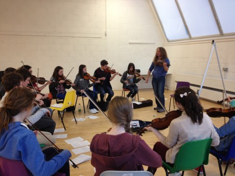 Ceol na Coille fiddle players rehearsing with Tola Cust ahead of this weekend's concert with Blazing Bows.
