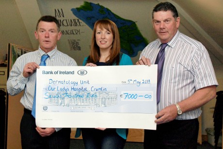 James Barrett and Davey McCarron presenting Angela Gallagher with a cheque for €7,000 for the dermatology unit at Our Ladys Childrens Hospital Crumlin. Angela is baby Lucy’s aunt.