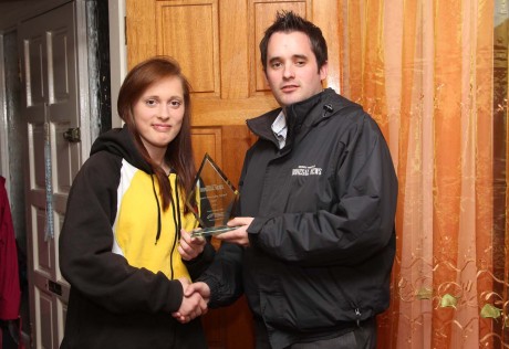 Donegal News Sports Writer Chris McNulty presents the April award to Austeja Auciute.