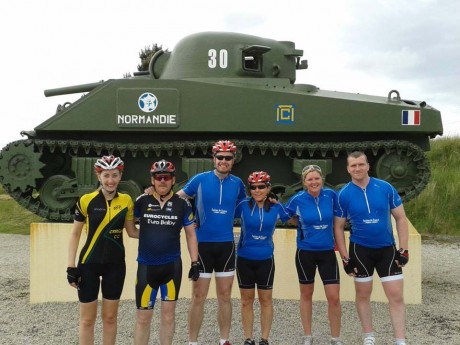 Jordanna (left) with a group of fellow cyclists at Utah beach.