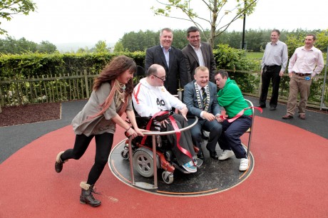 Taking a spin on the new ride at the Sweet Factory Play area which was re-opened in the Bernard McGlinchey Town Park, Letterkenny, this week are, Samantha Robinson, chairman of the charity S.N.A.P., Shaun McCosker, Christopher McBrearty, Cllr. Dessie Larkin, Mayor of Letterkenny, Cllr. Gerry McMonagle and Paddy Doherty, Letterkenny town clerk. The new play area is funded by Letterkenny Town Council in partnership with S.N.A.P.