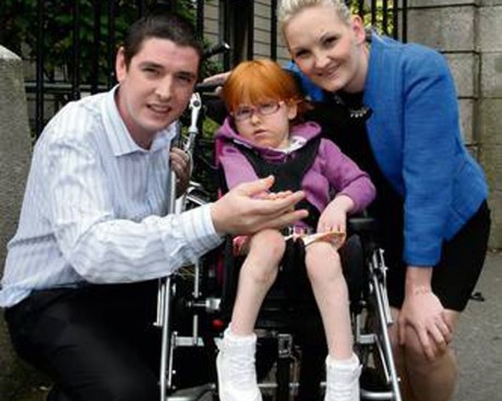 Sarah McFeely with her parents Ray and Bronagh at the High Court in Dublin. Photo: Courtpix
