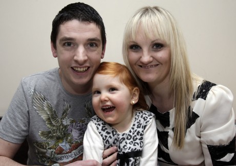 Ray McFeely and Bronagh Colhoun and their daughter Sarah (4).