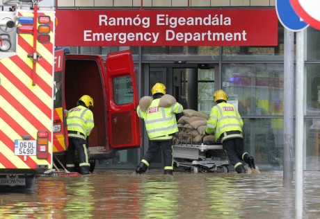 Fire officers bring sand bags into the new multi million euro Emergency Department after flash floods in Letterkenny. Photo: Donna McBride