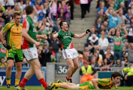 Donegal's Ryan McHugh lies on the ground as Cillian O'Connor celebrates after scoring his third and Mayo's fourth goal. 
