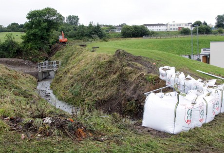 Sandbags in preparation of further heavy rainfall at the stream above the hospital. Photo: Donna McBride