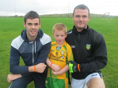 Odhran McNeilis and Neil McGee with Conor McEntee wearing the spina bifida wrist bands.