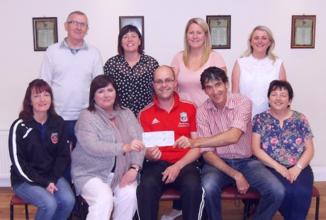 Seamus Hamilton presenting a cheque to SVP members. Included are, Charlie Doherty, Cathy Kelly, Diane Gallagher, Lisa O’Brien. (Front Row) Marie McColgan, Anne Marie Kelly, Seamus Hamilton, Joe Carlin, Alice Doherty.