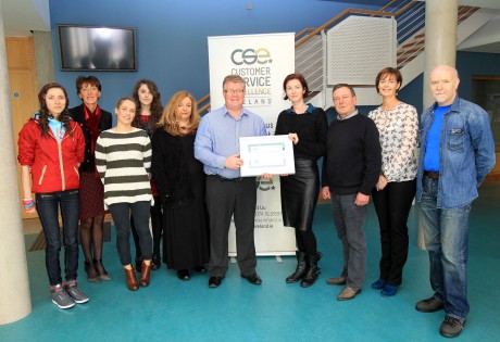 Charlie Boyle, Customer Service Excellence, Ireland making a presentation to Edel Corcoran, Earagail Arts Festival, also included are volunteers and EAF members Alison Graham, Patricia Graham, Aisling Viera, Kerry Graham, Caroline Jahn, Donegal Volunteer Centre, Gary Gomringer, Karen Murphy and Fintan Moloney.