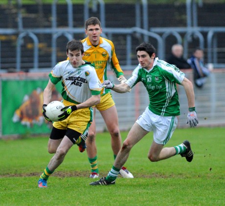 Glenswilly's Joe Gribbons is stretched by Roslea's Niall Cosgrove