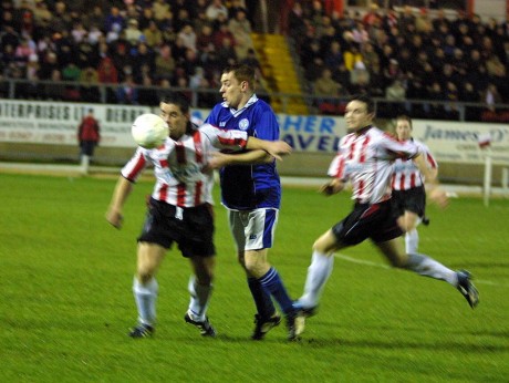 Niall Bonner in a tussle for possession at the Brandywell.