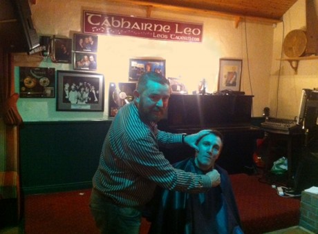 Cameron Campbell gets his 'Mo' shaved off by Dungloe barber Patrick Quinn.