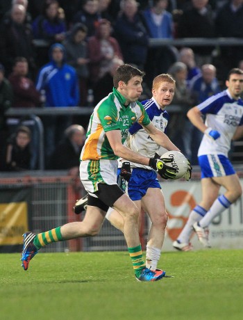 Joe Gibbons in action for Glenswilly against Coilin Devlin of Ballinderry.