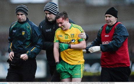 Martin O'Reilly leaves the field during the second half of Sunday's game against Tyrone with an injury. 
