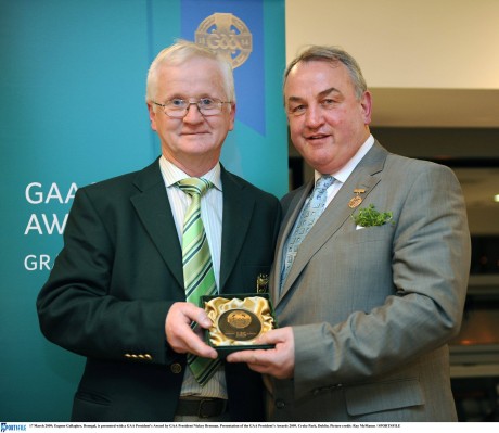 Eugene Gallagher pictured accepting a GAA President's Award from former GAA President Nickey Brennan in 2009.