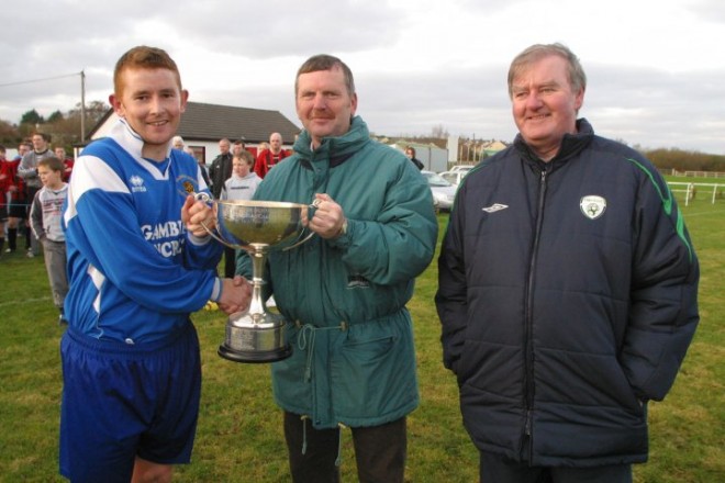 Eamon McConigley presents the 2007 USL trophy to Kildrum Tigets captain Glenn Bovaird. ALso pictired is Dessie Kelly. McConoley has been named at right-back on the USL team.