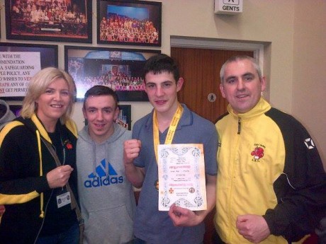 Leon Gallagher celebrates his Ulster final win with Finn Valley ABC members Sharon Scanlon, Darren Kelly, and club coach Billy Quigley.