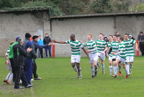 Castlebar Celtic's Thierry Baba celebrates with management and team mates after putting his side ahead during last Saturday's game against Swilly Rovers.