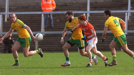 Donegal's Karl Lacey battles with Armagh's Kyle Carragher, as Neil Gallagher and Frank McGlynn support him.