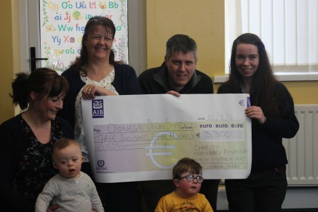 Clodagh Barry (right) presents a cheque for 3300 euro to Gearoid Melvin and Maureen Jordan, Chairman and Secretary of the Donegal Down Syndrome  Association.