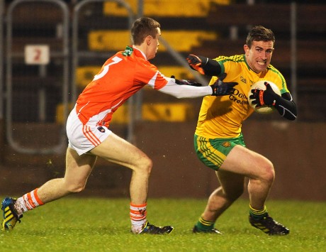 Patrick McBrearty, who scored eight points, rounding Armagh full back Seamus Kelly.