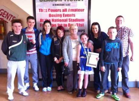 Raphoe's Cody Lafferty with family and friends after winning the Girl 1 title on Saturday