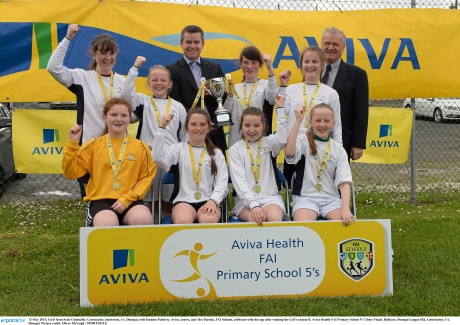 Girls from Scoil Cholmcille, Greencastle, Innisowen with Damien Flaherty, Aviva, centre, and Alex Harkin, FAI Schools, celebrate with the cup after winning the Girl's section B. Aviva Health FAI Primary School 5's Ulster Finals, Ballyare, Donegal League HQ, Letterkenny. Photo: Oliver McVeigh / SPORTSFILE