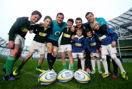 Jamie Heaslip, Peter O'Mahony and Brian O'Driscoll with some children who will be participating in the event. Photo: NPHO/Donall Farmer