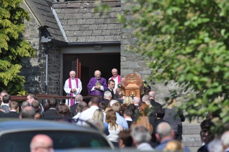 The coffin of Oisin Crawford arrives at St Baithin's Church, St Johnston.