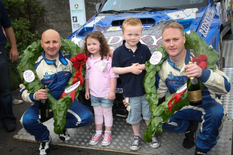 Ronan and Jesica Boyle enjoy the celebration with Declan and Brian Boyle as overall winners  at the finishing ramp of the Donegal International Rally . Photo Cristeph/Brian McDaid