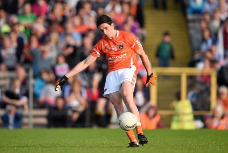 Rory Grugan, Armagh, kicks a point from a free in the last seconds to equalise the game and send it to a replay. 