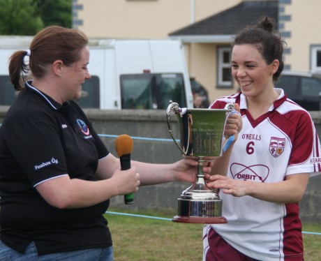 Termon captain Therese McCafferty receives the All-Ireland Gaeltacht Cup in Moycullen