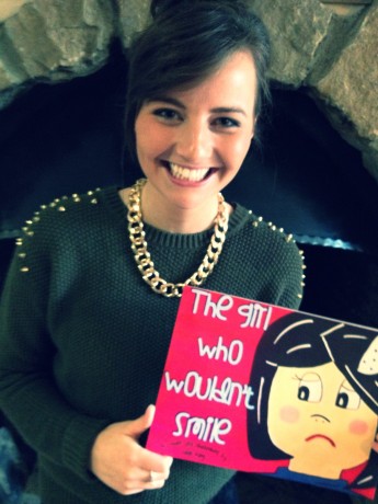 Sarah with her first book.