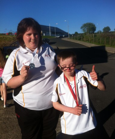 Marian Gallagher and Kyle Glackin with their medals at the homecoming in Glenfin on Tuesday evening