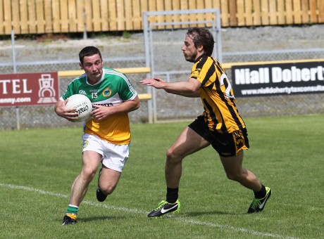 David O'Herlihy, St Eunans closes in on Darren McGinley, Glenswilly. Photo: Donna El Assaad