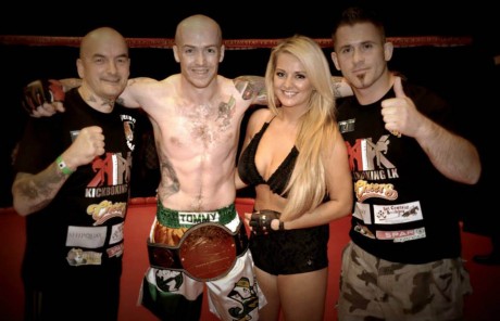 Tommy with coaches China Coyle and Marty McLaughlin after winning the Chaos Fighting Championship Featherweight title.