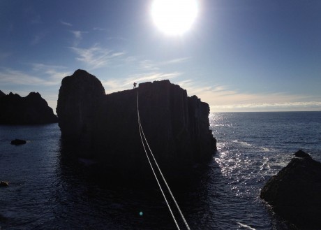 A tyrolean traverse off a sea stack at An Port, located along the coast between Ardara and Glencolmcille. Photo: courtesy of Iain Miller.