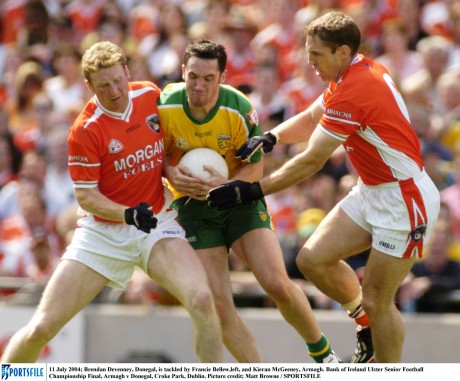 Brendan Devenney, Donegal, is tackled by Francie Bellew,left, and Kieran McGeeney in the 2004 Ulster final.