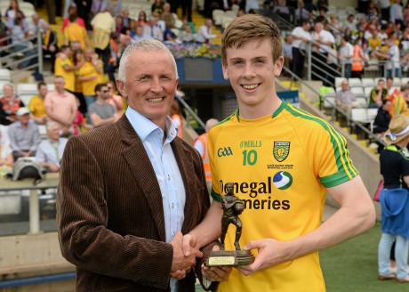 Eoghan Ban Gallagher receives the Man of the Match award at the Ulster final from Electric Ireland's Vincent Litchfield