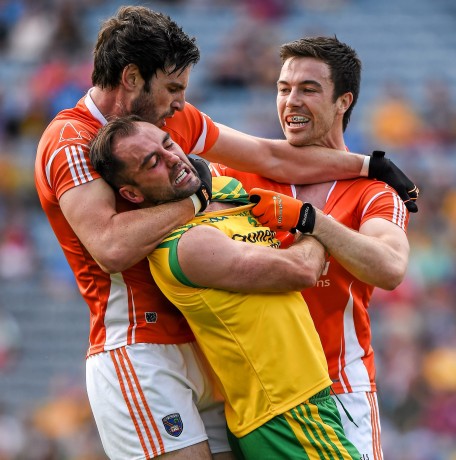 Armagh's Aaron Findon, left, gets involved, and was later given a yellow card, in the altercation between Karl Lacey and Aidan Forker