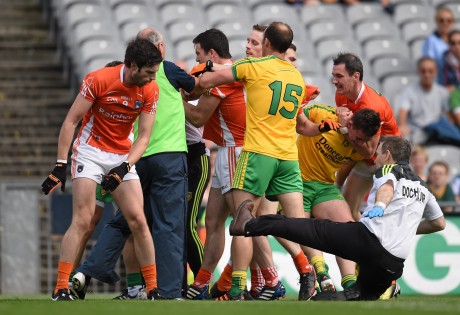 Aaron Findon, Armagh, pushes Donegal team doctor Kevin Moran during an altercation in the first half. 