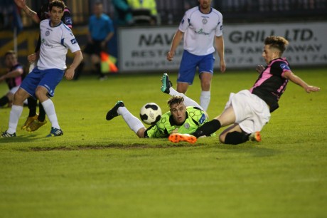 Conor Winn, the Finn Harps goalkeeper, watches anxiously as Andy Mulligan of Wexford Youth just about fails to connect with this ball as he slides in at the back post. Photo: Gary Foy