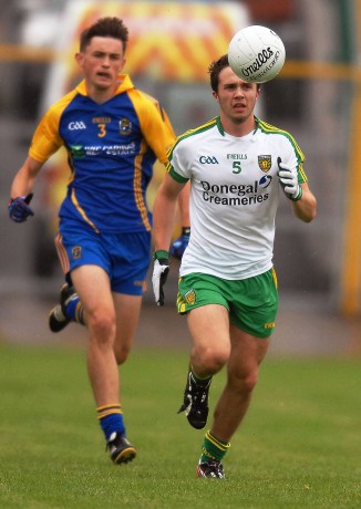 The outstanding Cian Mulligan, coming forward for Donegal, with Roscommons Brian Stack in his slipstream.
