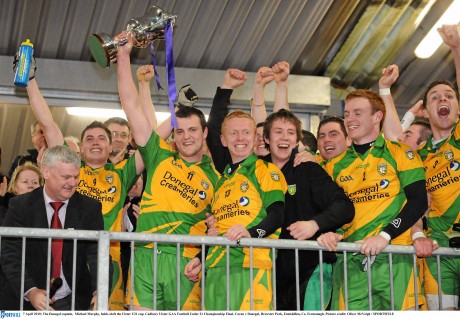 James Carroll pictured next Michael Murphy as the Donegal captain lifts the Ulster Under-21 Cup in 2010. Carroll will be back from Abu Dhabi for this weekend's All-Ireland finals