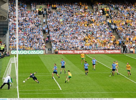 Ryan McHugh, Donegal, scores his side's second goal past Dublin goalkeeper Stephen Cluxton.