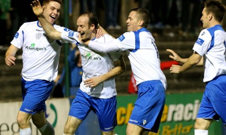 Sean McCarron, Kevin McHugh and Ger O'Callaghan celebrate with Michael Funston after he scores Harps' third goal. Photo: Gary Foy