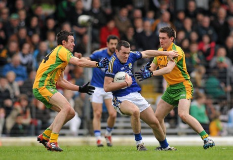 David Walsh and Martin O'Reilly in action against Kerry's Brian McGuire in a League game in 2012